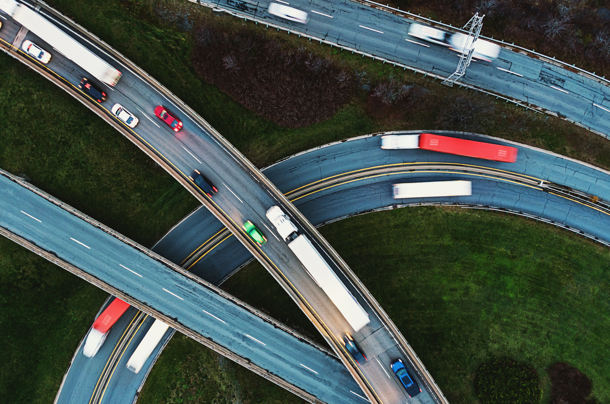 Aerial view of trucking traffic on a November evening. Composite image.